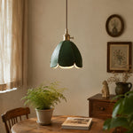 Load image into Gallery viewer, Green leather petal pendant light in a quiet dining corner
