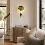 Load image into Gallery viewer, Decorative leaf wall sconce in a garden setting