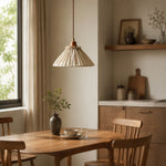 Charger l'image dans la visionneuse de galerie, Natural linen pendant light glowing above a round dining table