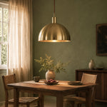 Bild in Gallery-Viewer laden, Brass dome pendant light in a warm interior setting