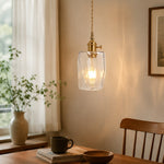 Cargar imagen en el visor de la Galería, Style X open-frame clear glass pendant in a warm interior corner