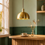 Bild in Gallery-Viewer laden, Brushed brass half dome pendant light against a green wall