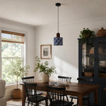 Bild in Gallery-Viewer laden, Blue floral fabric drum pendant light above a dining table