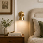 Cargar imagen en el visor de la Galería, Brass wall lamp installed in a warm interior