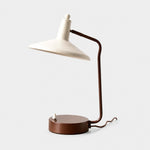 Bild in Gallery-Viewer laden, Front view of Japanese iron desk lamp with ivory shade and brown frame