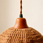 Load image into Gallery viewer, Wood lamp cup and twisted cord detail on woven pendant light
