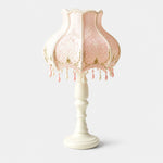 Load image into Gallery viewer, Pink beaded lace table lamp with fringe on a light background