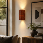 Load image into Gallery viewer, Brown leather wall sconce installed beside a sofa and window