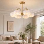 Load image into Gallery viewer, 6-light gold chandelier installed in a bright living room