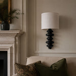 Cargar imagen en el visor de la Galería, Ebony wall lamp installed beside a fireplace
