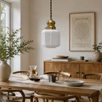 Charger l'image dans la visionneuse de galerie, Vintage brass glass pendant lamp above a warm dining table