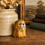 Cargar imagen en el visor de la Galería, Wooden lion figurine with books and vase