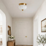Bild in Gallery-Viewer laden, Compact brass and glass flush mount in a bright entry