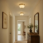 Bild in Gallery-Viewer laden, Two brass and opal glass ceiling lights in a hallway