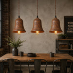 Cargar imagen en el visor de la Galería, Three rust bell pendant lights over an industrial dining counter