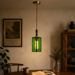 Bild in Gallery-Viewer laden, Green glass pendant installed in a warm interior