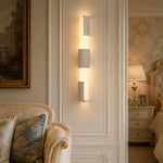 Cargar imagen en el visor de la Galería, Three-section travertine acrylic wall lamp on a paneled bedroom wall