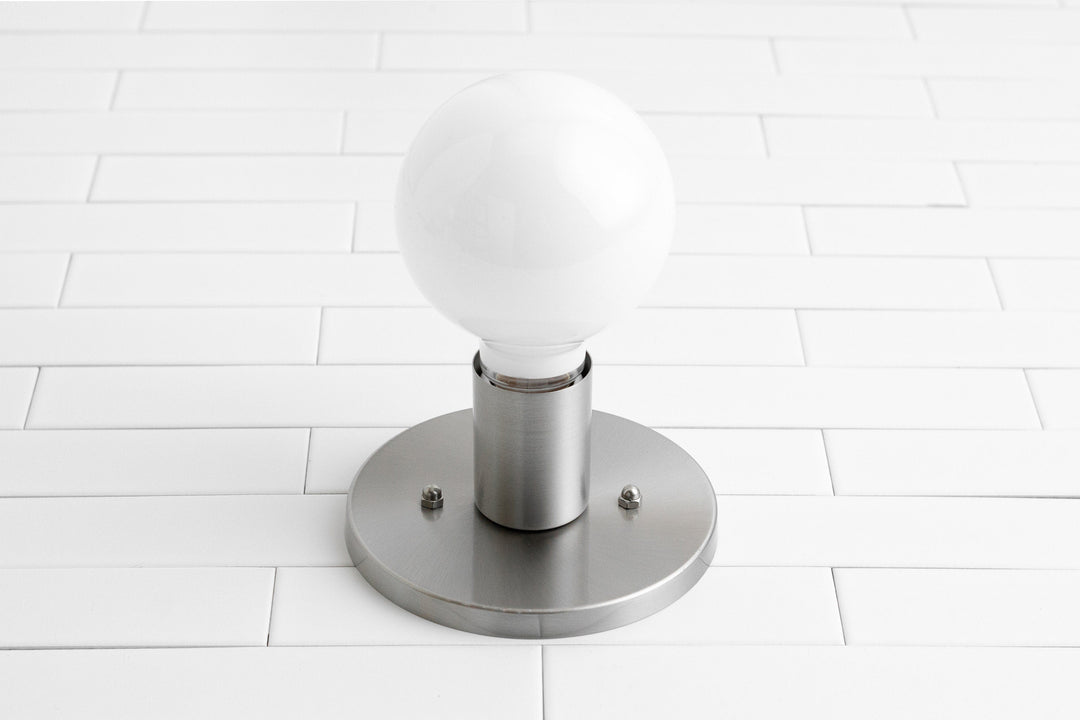 Aplique de pared minimalista de vidrio Glorica: una luz moderna y versátil para cualquier habitación