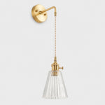 Bild in Gallery-Viewer laden, Clear glass wall light with brass arm, KW shade 12 cm high and 13 cm diameter