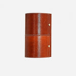 Load image into Gallery viewer, Brown leather wrapped cylinder wall sconce on clean background