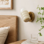 Load image into Gallery viewer, Cream wall sconce beside bed