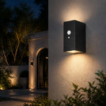 Cargar imagen en el visor de la Galería, Style C outdoor wall lamp casting light on a garden entry wall