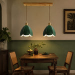 Load image into Gallery viewer, Green linear leather pendant light over a dining table