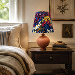 Load image into Gallery viewer, Painter floral table lamp styled in a bedroom