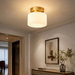 Cargar imagen en el visor de la Galería, Warm ceiling light in a hallway with wall art
