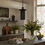 Cargar imagen en el visor de la Galería, Black woven mesh pendant light in a warm kitchen shelf setting