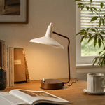 Bild in Gallery-Viewer laden, Wabi-sabi iron desk lamp glowing beside notebooks and a ceramic mug