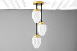 Load image into Gallery viewer, Tierlux Glass Tiered Skyscraper Shade Pendant – Art Deco Ceiling Light for Kitchen Island
