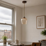 Bild in Gallery-Viewer laden, Amber glass pendant light in a warm window-side interior