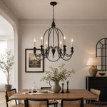 Load image into Gallery viewer, Black six-light candle chandelier in a classic dining room