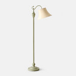 Charger l'image dans la visionneuse de galerie, Sage green curved-arm floor lamp with ivory fabric shade on a light background