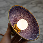 Bild in Gallery-Viewer laden, Handheld view of the purple blue ceramic glaze interior