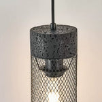 Cargar imagen en el visor de la Galería, Close view of black stone top, mesh shade, and warm light