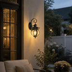 Load image into Gallery viewer, Black outdoor wall lantern on a patio wall