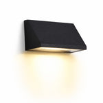 Cargar imagen en el visor de la Galería, Black wall light glowing on an exterior wall at night