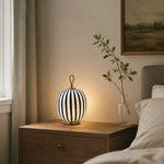 Cargar imagen en el visor de la Galería, Blue striped rechargeable glass lamp on a bedside table