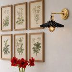 Bild in Gallery-Viewer laden, Black wall sconce above framed botanical art
