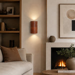 Load image into Gallery viewer, Brown leather wall sconce installed in a bedroom seating area