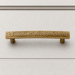 Cargar imagen en el visor de la Galería, Hammered brass cabinet pull on white cabinet drawer