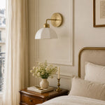 Load image into Gallery viewer, White milk glass wall lamp installed beside a bed