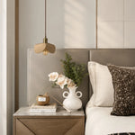 Load image into Gallery viewer, Leather petal pendant light above a bedroom nightstand