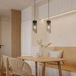 Cargar imagen en el visor de la Galería, Pair of black mesh pendant lights installed over a cafe table