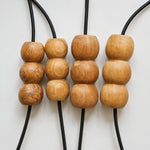 Bild in Gallery-Viewer laden, Natural variation across handcrafted wood bead pendant components