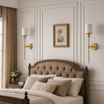 Cargar imagen en el visor de la Galería, Natural brass wall sconces in a bedroom