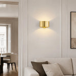 Load image into Gallery viewer, Gold brass wall light in a refined interior