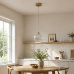 Load image into Gallery viewer, Glass pendant lamp above a dining table
